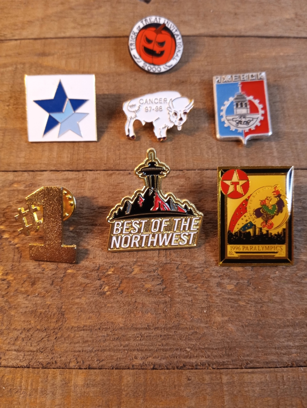 Lot of seven metal and enamel pins
